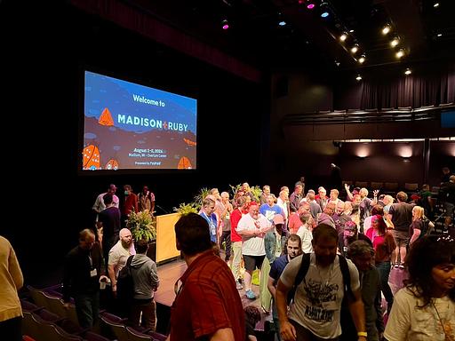 "Closing out Madison+ Ruby 2024 with a group photo on stage" - @andatki